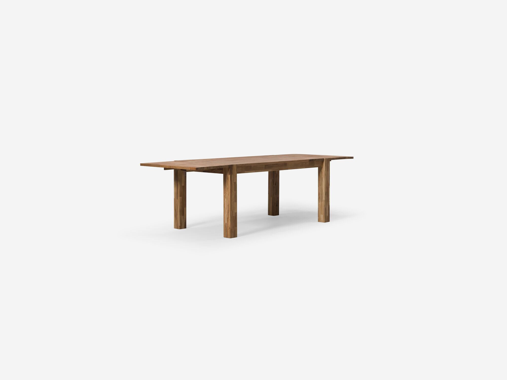 Angled view of the small oak Harvest rustic dining table with leaves